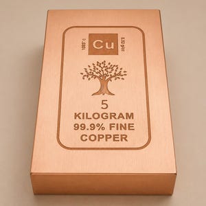 May include: A rectangular copper bar with a brushed finish. The centre features an engraved tree icon, the chemical symbol Cu, and text stating 5 KILOGRAM 99.9% FINE COPPER, along with the melting point 1085° C and density 8.92 g/cc.