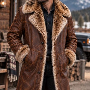 May include: A long brown leather coat featuring a thick, textured faux fur lining that extends along the wide lapels, collar, and sleeve cuffs. The coat has a button-front closure and a weathered, distressed finish on the outer leather surface.