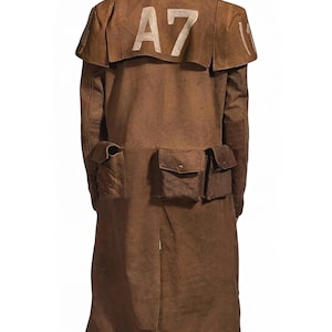 May include: A brown, long coat with multiple pockets and a cape-like detail on the shoulders. The text "A7" is printed in white on the back of the coat. The coat has a button closure and a slit in the back.