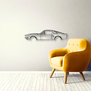 May include: A black metal wall art piece featuring the minimalist outline of a classic fastback car. The design captures the side profile of the vehicle with clean lines, showcasing the hood, roofline, and rear deck in a single continuous form.