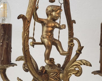 Lyre Shaped French Petite Chandelier With Cherub Putto on Swing