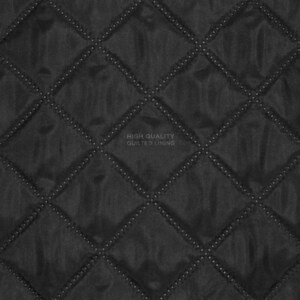 A black fabric material featuring a quilted diamond pattern with stitched lines. The centre of the image displays the text HIGH QUALITY QUILTED LINING in a light grey font, indicating the texture and construction of the textile surface.