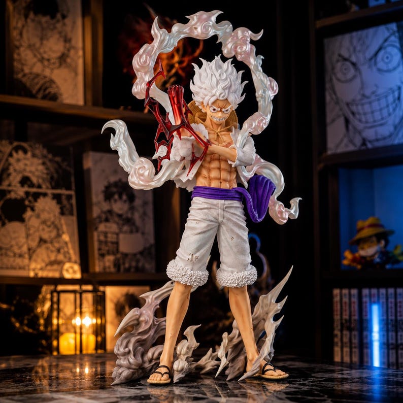 May include: A detailed figurine of a character with spiky white hair, wearing white shorts, a purple sash, and sandals. The figure has a muscular physique and is surrounded by a swirling, cloud-like effect. A red weapon is held in the character's hand.