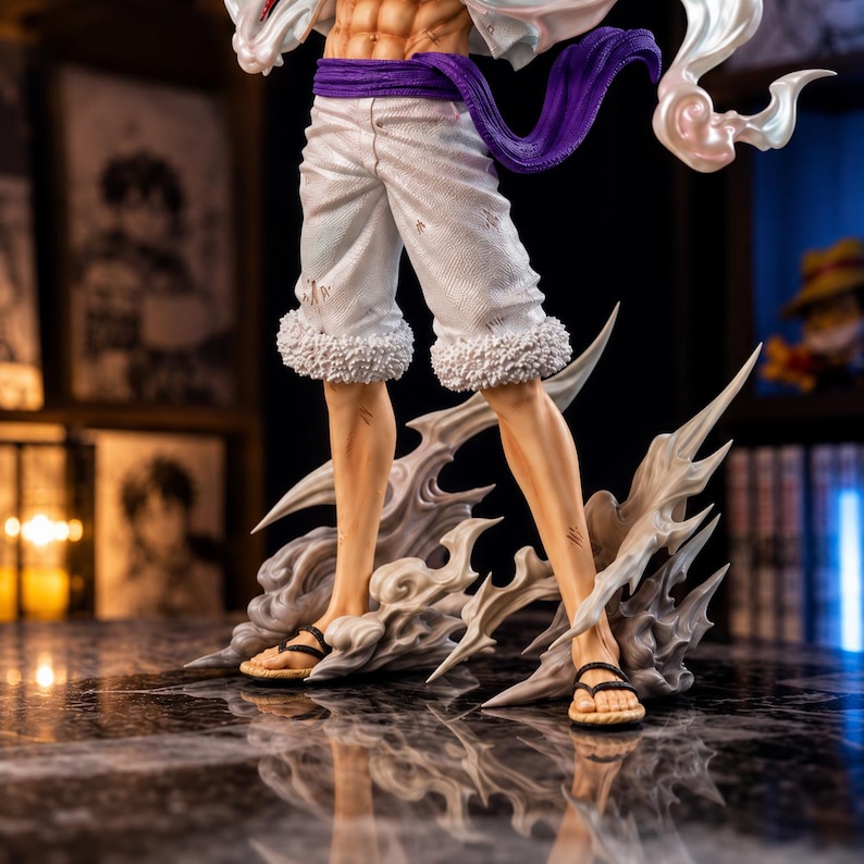 May include: A detailed figurine of a character in a dynamic pose. The figure wears white shorts with a fluffy trim, a purple sash, and sandals. The figure is standing on a stylized cloud base with sharp, white accents. The character's skin tone is tan.