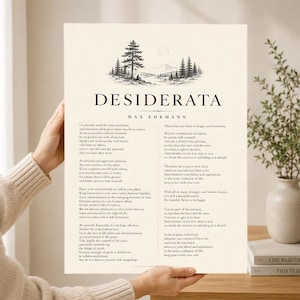 May include: A cream-colored paper print featuring the title Desiderata by Max Ehrmann in black text. The top displays a black ink illustration of a forest landscape with mountains and a sun. The poem is printed in two columns in a serif font.