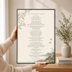 May include: A rectangular framed print featuring the poem If I Ever Have Girls by Daragh Fleming. The text is printed in black on a cream background, decorated with botanical illustrations of flowers and birds, and a landscape scene at the bottom.