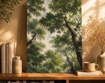 May include: A rectangular wall art print featuring a low-angle view of a dense forest canopy with tall, textured tree trunks and lush green foliage reaching toward a pale, cloudy sky. The artwork is displayed on a wooden shelf with books.
