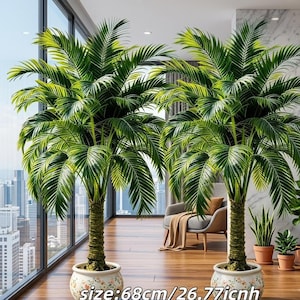 May include: Two artificial palm trees with vibrant green fronds and textured brown trunks, each planted in a round white ceramic pot featuring a delicate floral pattern. The base of each pot is clearly marked with the size 68cm/26.77inch.