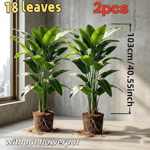 Può includere: Due piante artificiali con 18 foglie ciascuna, alte 103 cm. Le piante hanno grandi foglie verdi e radici esposte. L'immagine include il testo "2pcs" e "without flowerpot".