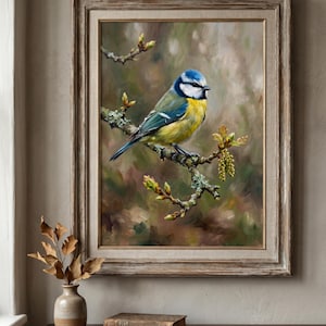 May include: A framed painting of a blue tit bird perched on a branch with green and yellow leaves. The bird has a blue head, white cheeks, and yellow breast. The painting is in a wooden frame and is displayed on a wall.