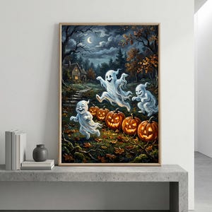 May include: A framed wall art print depicting a nighttime forest scene with three white ghosts running through a field of glowing orange jack-o'-lanterns. In the background, a small house sits under a crescent moon amidst dark trees and autumn leaves.