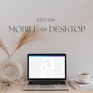 May include: A laptop screen displays a digital birthday invitation template featuring a goose illustration and the text Noah is one silly goose. The text EDIT ON MOBILE OR DESKTOP is centered above the laptop. A white vase and coffee cup are present.