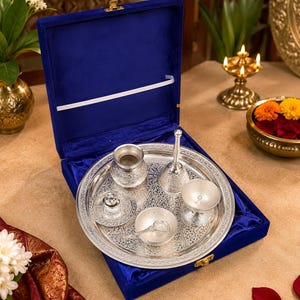 German silver pooja thali set
Silver plated puja thali
Velvet gift box pooja set
Hindu worship accessories
Diwali pooja thali set
Traditional silver puja tray
Lakshmi Ganesh pooja accessories
Wedding return gift set
Housewarming spiritual gift
Decorative German silver thali
Home temple worship kit
Religious ceremony accessories
Festival gifting puja set
Silver Thali Set Gift