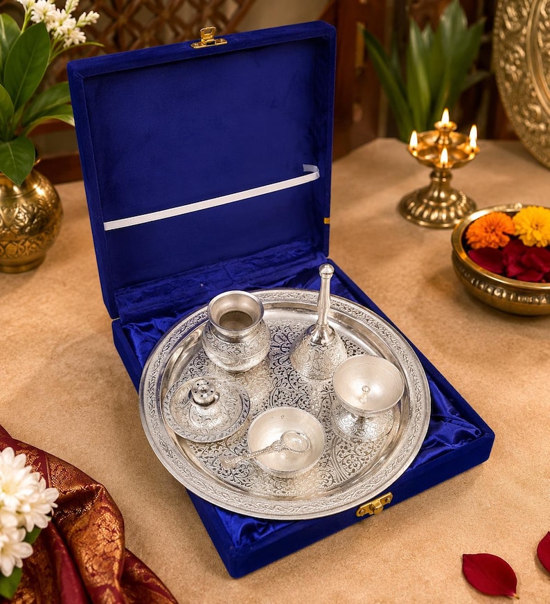 German silver pooja thali set
Silver plated puja thali
Velvet gift box pooja set
Hindu worship accessories
Diwali pooja thali set
Traditional silver puja tray
Lakshmi Ganesh pooja accessories
Wedding return gift set
Housewarming spiritual gift
Decorative German silver thali
Home temple worship kit
Religious ceremony accessories
Festival gifting puja set
Silver Thali Set Gift