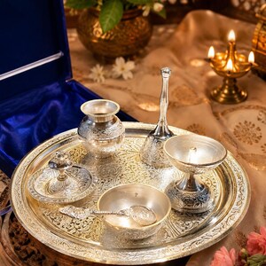 German silver pooja thali set
Silver plated puja thali
Velvet gift box pooja set
Hindu worship accessories
Diwali pooja thali set
Traditional silver puja tray
Lakshmi Ganesh pooja accessories
Wedding return gift set
Housewarming spiritual gift
Decorative German silver thali
Home temple worship kit
Religious ceremony accessories
Festival gifting puja set