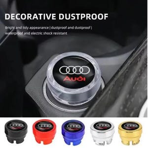 May include: A clear, decorative dustproof Audi car accessory with the Audi logo in white and red text. The image shows the accessory installed and several colored options: black, red, blue, silver, and gold.