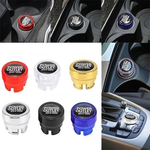 May include: A collection of car power outlet plugs in various colors, including red, white, gold, silver, black, and blue. Each plug has the text "POWER OUTLET MAX 120W" printed on it. The plugs are shown both installed and individually.