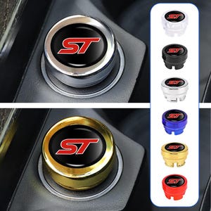 May include: Car accessories with a circular design, displaying the letters "ST" in red on a black base. Available in silver, gold, black, blue, and red. The "ST" logo is a key feature. The accessories are designed for automotive use.
