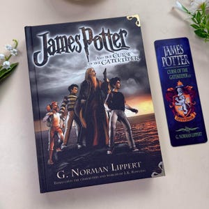 May include: A hardcover book titled "James Potter and the Curse of the Gatekeeper" with a matching bookmark. The book cover features illustrations of characters and the title. The bookmark displays the title, Gryffindor crest, and author's name.