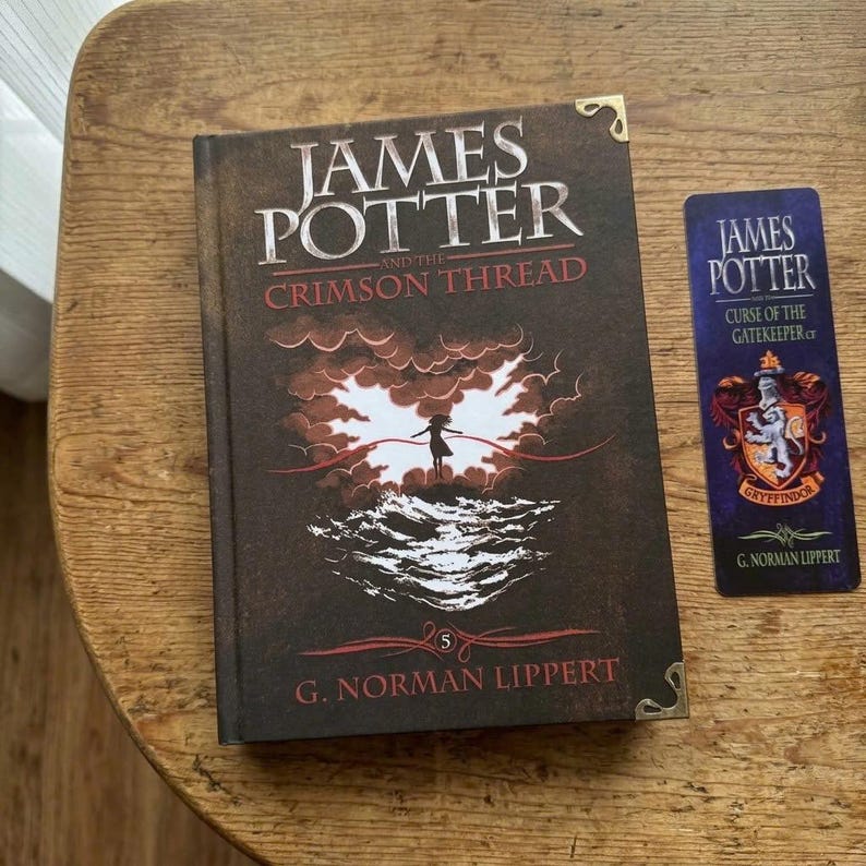 May include: A hardcover book titled James Potter and the Crimson Thread by G. Norman Lippert with a dark brown cover featuring a silhouette figure and a red thread, alongside a matching vertical bookmark with a crest and the title text.