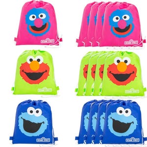 May include: A collection of drawstring bags in pink, green, and blue, each featuring a Sesame Street character. The bags have white drawstrings and the Sesame Street logo. The characters include Elmo, Cookie Monster, and Oscar.