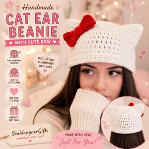 May include: A white crocheted beanie featuring two pointed cat ears and a bright red bow attached to the left side. The beanie has a textured knit pattern and is shown from the front and back. Text on the image includes HANDMADE CAT EAR BEANIE.