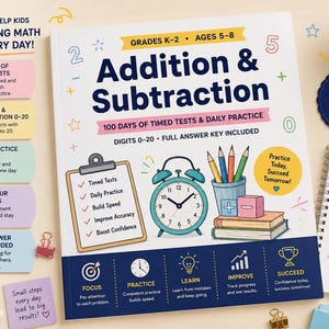 May include: A maths workbook titled Addition & Subtraction for grades K-2, ages 5-8. The cover features a clipboard, an alarm clock, pencils in a cup, and books. It includes 100 days of timed tests, daily practice pages, and a full answer key.
