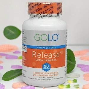 May include: A white bottle of "GOLO Release" dietary supplement with an orange label. The label includes the text "90 Capsules" and "Supports insulin sensitivity and relieves everyday stress." The bottle has a red and orange seal.