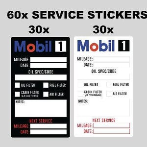 Op de afbeelding: Een set van 60 service-stickers met het Mobil 1 logo. De collectie bevat 30 zwarte en 30 witte rechthoekige labels met velden voor kilometerstand, datum, oliespecificatie en selectievakjes voor olie-, brandstof-, interieur- en luchtfilters.
