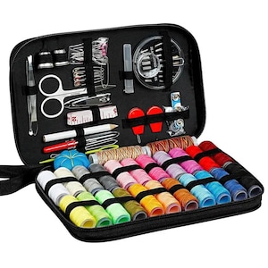 May include: A black zippered sewing kit case containing various sewing supplies including multiple spools of colored thread, silver scissors, a white measuring tape, a blue pin cushion, metal thimbles, needles, and assorted sewing tools secured by elastic bands.