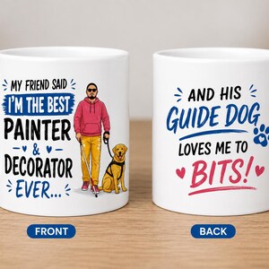 May include: Two white ceramic mugs featuring a cartoon illustration of a person with a guide dog. The front text reads: MY FRIEND SAID I'M THE BEST PAINTER & DECORATOR EVER. The back text reads: AND HIS GUIDE DOG LOVES ME TO BITS!