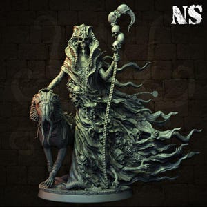 May include: A detailed sculpture of a robed figure with a skull-like face, holding a staff topped with skulls and a curved horn. The figure is adorned with skulls and chains, and is accompanied by a creature with tentacles. The sculpture is in shades of gray.