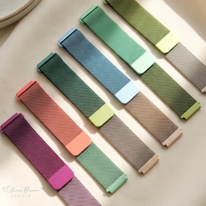 May include: An assortment of colorful watch bands in various shades, including purple, coral, green, and blue. Each band features a mesh design and a contrasting colored clasp. The bands are arranged diagonally, showcasing their different hues.