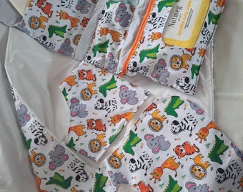 A handmade foldable fabric baby changing organiser and two bibs