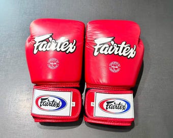 Guantes de boxeo Fairtex de cuero negro: guantes profesionales para muay thai, kickboxing y entrenamiento.
