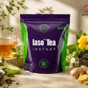 May include: A purple and green packet of Iaso Tea Instant is shown, with the product name clearly visible. The image includes a cup of tea, fresh ginger, and other tea ingredients, suggesting a health and wellness product.