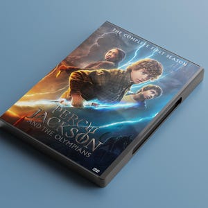 May include: A DVD case for "Percy Jackson and the Olympians: The Complete First Season." The cover shows three characters with a backdrop of lightning and a fiery sky. The title is displayed in a stylized font.