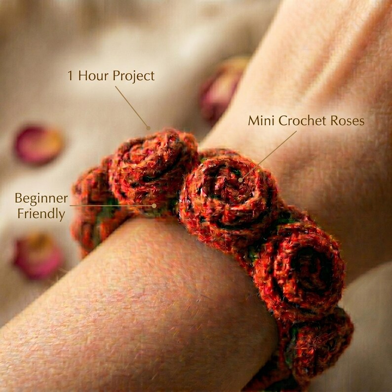 May include: A bracelet made of mini crochet roses in shades of red and orange with green accents. The image includes text labels that read 1 Hour Project, Mini Crochet Roses, and Beginner Friendly, pointing to the crocheted floral design.