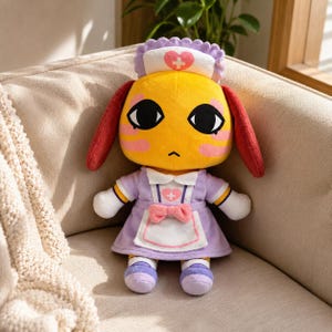 May include: A plush toy featuring a yellow character with large black eyes, red ears, and pink cheek markings. The character wears a lavender nurse dress with a white apron, a pink bow, and a matching nurse cap, both decorated with a pink heart and cross.