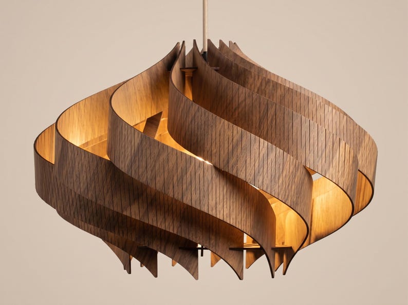 May include: A wooden pendant light. The light features a distinctive, swirling design, constructed from curved, layered wooden slats. The open form allows light to filter through. The warm wood tones and the light create a cozy ambiance. The light is suspended from the ceiling.