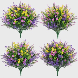 Pode incluir: Quatro arbustos de flores artificiais com uma variedade de flores coloridas. As flores s&atilde;o uma mistura de amarelo, rosa e roxo, com folhagem verde. Os arbustos t&ecirc;m caules verdes e est&atilde;o dispostos sobre um fundo branco.