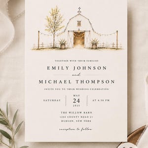 May include: A 5x7 inch wedding invitation card featuring a watercolor illustration of a white barn with string lights, a tree, and floral arrangements. The text includes names Emily Johnson and Michael Thompson, date May 24, 2025, and venue details.