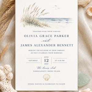 May include: A wedding invitation card featuring a watercolor illustration of beach grass and the ocean at the top. The text includes the names Olivia Grace Parker and James Alexander Bennett, the date June 12, 2027, and The Dunes Club location.