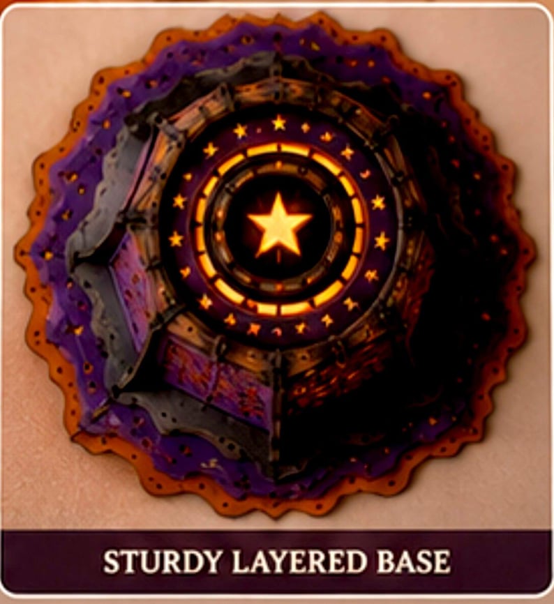 May include: A circular, multi-layered decorative base featuring a deep purple and orange color scheme. The center displays a bright yellow star surrounded by a ring of smaller stars and geometric cutouts. The text STURDY LAYERED BASE is visible.