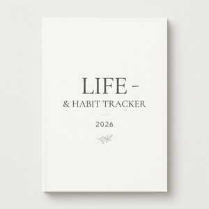 Puede incluir: Un diario blanco Life & Habit Tracker para 2026. La portada presenta el título en una fuente gris oscuro, con el año y una pequeña ilustración botánica debajo. El diario tiene un diseño limpio y minimalista.