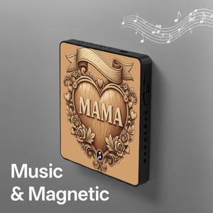 May include: A black, rectangular music player with a wooden heart design that says "MAMA". The heart is surrounded by roses and a banner. The text "Music & Magnetic" is at the bottom.