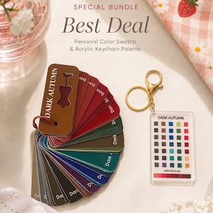 May include: A personal colour swatch fan deck labelled Dark Autumn with various coloured cards, paired with a clear acrylic keychain palette featuring a grid of small coloured squares and the text Dark Autumn and Make Up Color.