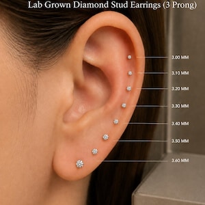 May include: Lab grown diamond stud earrings with 3 prongs, displayed in a series of sizes ranging from 3.00 mm to 3.60 mm. The clear, round-cut stones are arranged vertically along the ear, each labeled with its specific diameter in millimeters.