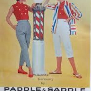 May include: Vintage fashion advertisement featuring two women in stylish outfits. One wears a red top and gray pants, the other a red top and white capri pants. Both wear matching hats. A barber pole stands between them. The ad includes the text "Clothes by Harmony" and "Paddle & Saddle".