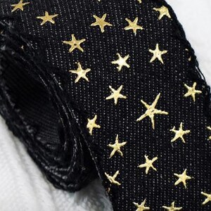 1.	Denim ribbon with embossed star pattern 
2.	Vintage washed denim ribbon for DIY crafts 
3.	3D star textured ribbon close-up 
4.	Blue jean ribbon with decorative edge trim 
5.	Black denim ribbon for fashion accessories 
6.	Textured ribbon for hair bow making 
7.	Assorted denim ribbons in multiple shades 
8.	Fabric ribbon for clothing embellishment 
9.	Stylish denim trim for handmade projects 
10.	Wide denim ribbon rolls for crafts